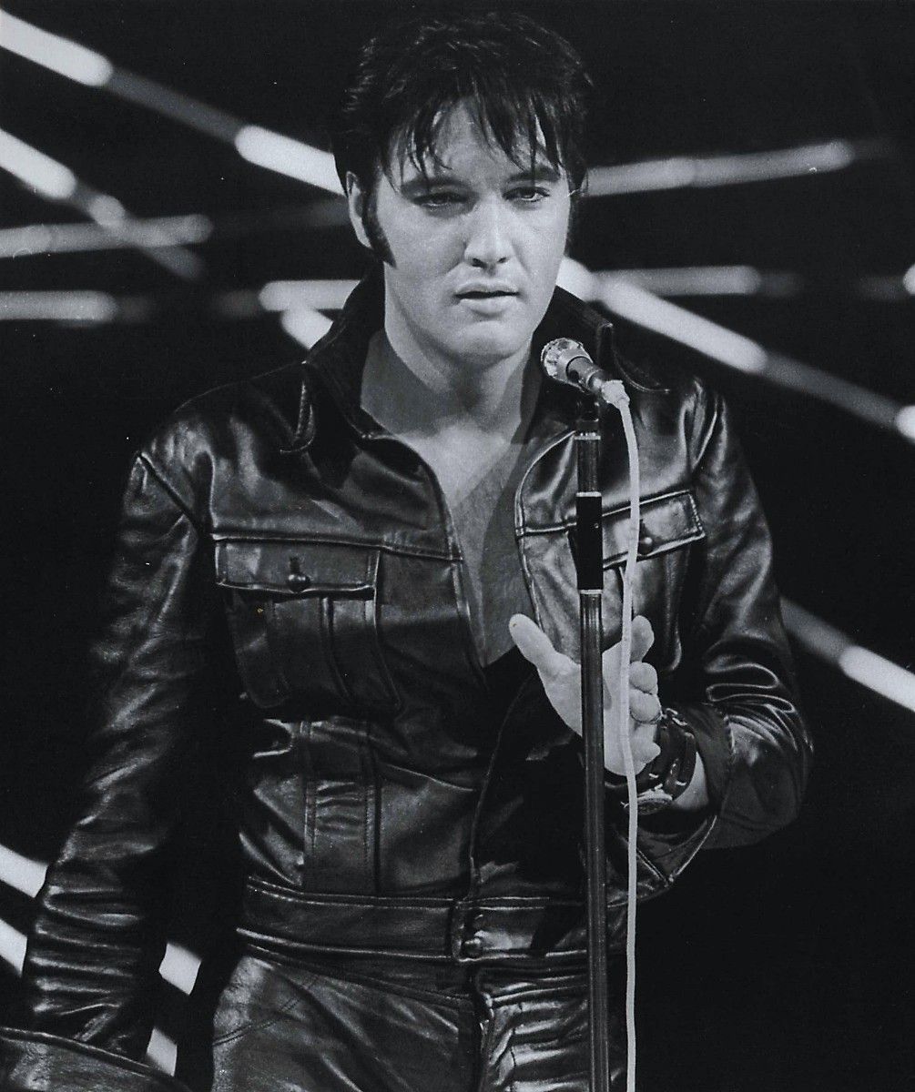 Elvis in a black jumpsuit
