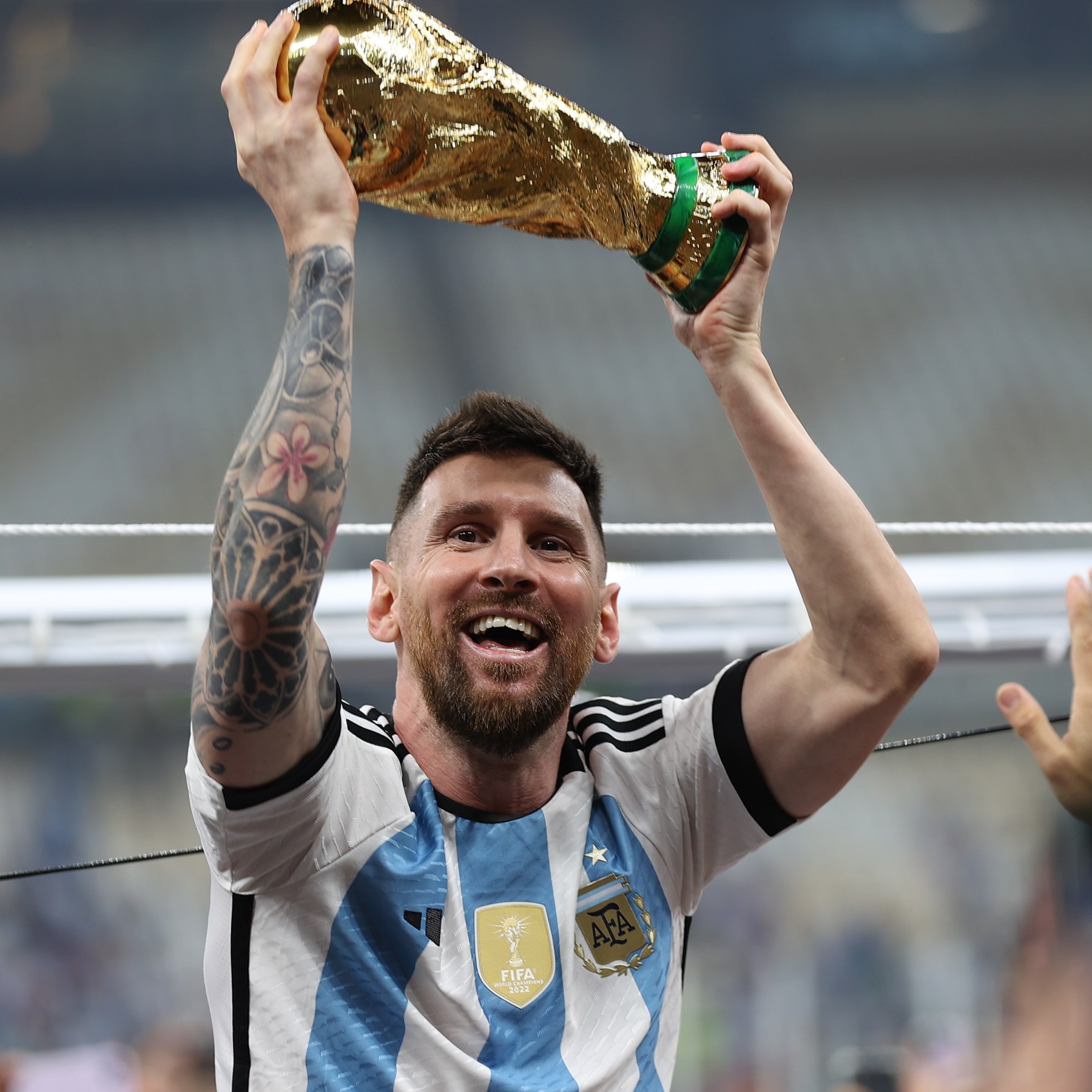 messi lifting world cup trophy