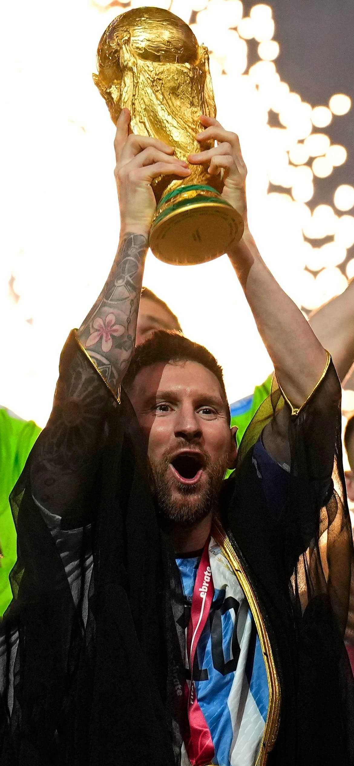 Messi lifting World Cup.