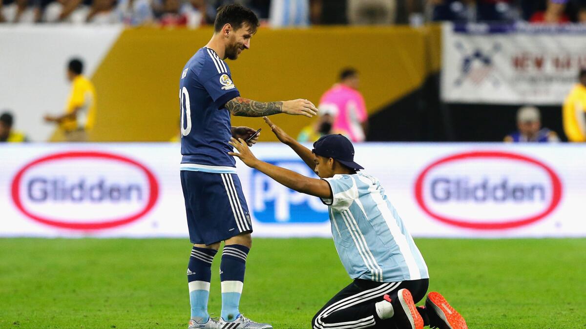 messi taking picture with fan 0010
