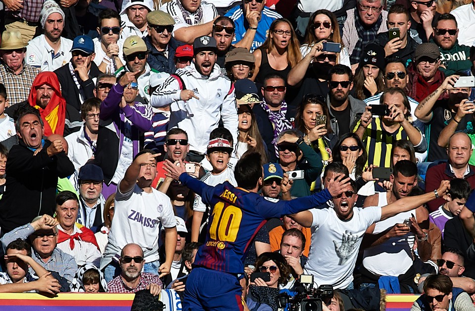 messi taking picture with fan 0025