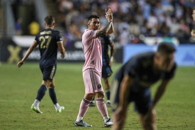 messi taking picture with fan 0048