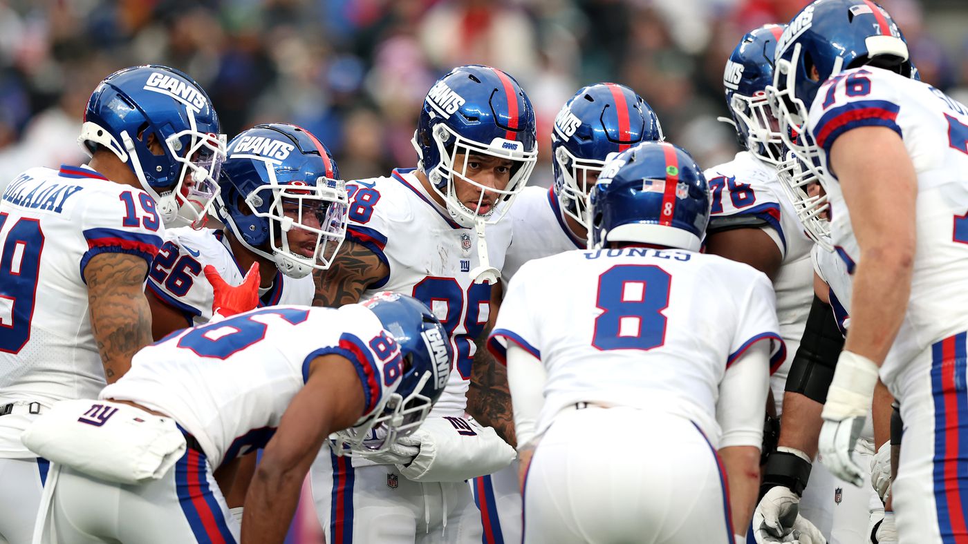 New York Giants team huddles