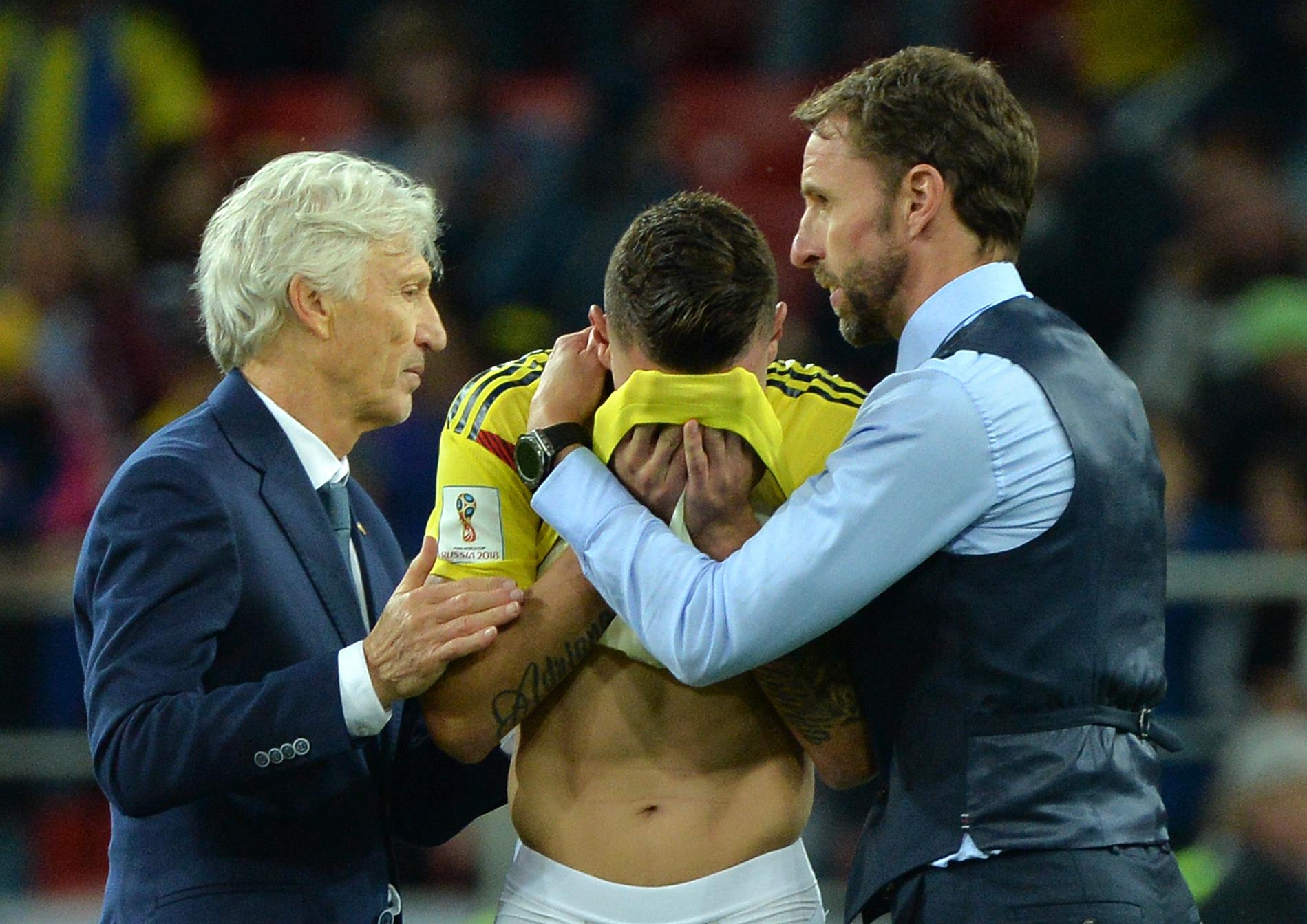 Gareth Southgate comforts Miguel Borja with Jose Pekerman