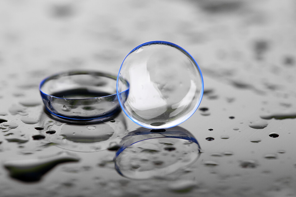 contact lenses for sports with water drops on a gray background