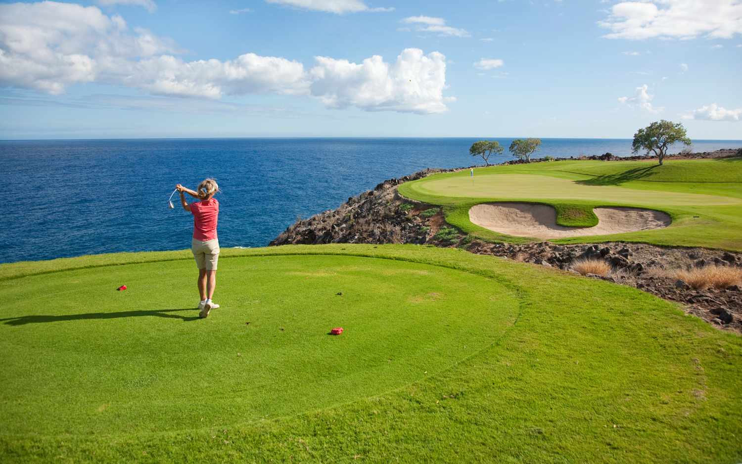 Competitive golf enthusiasts explore amazing golf courses worldwide