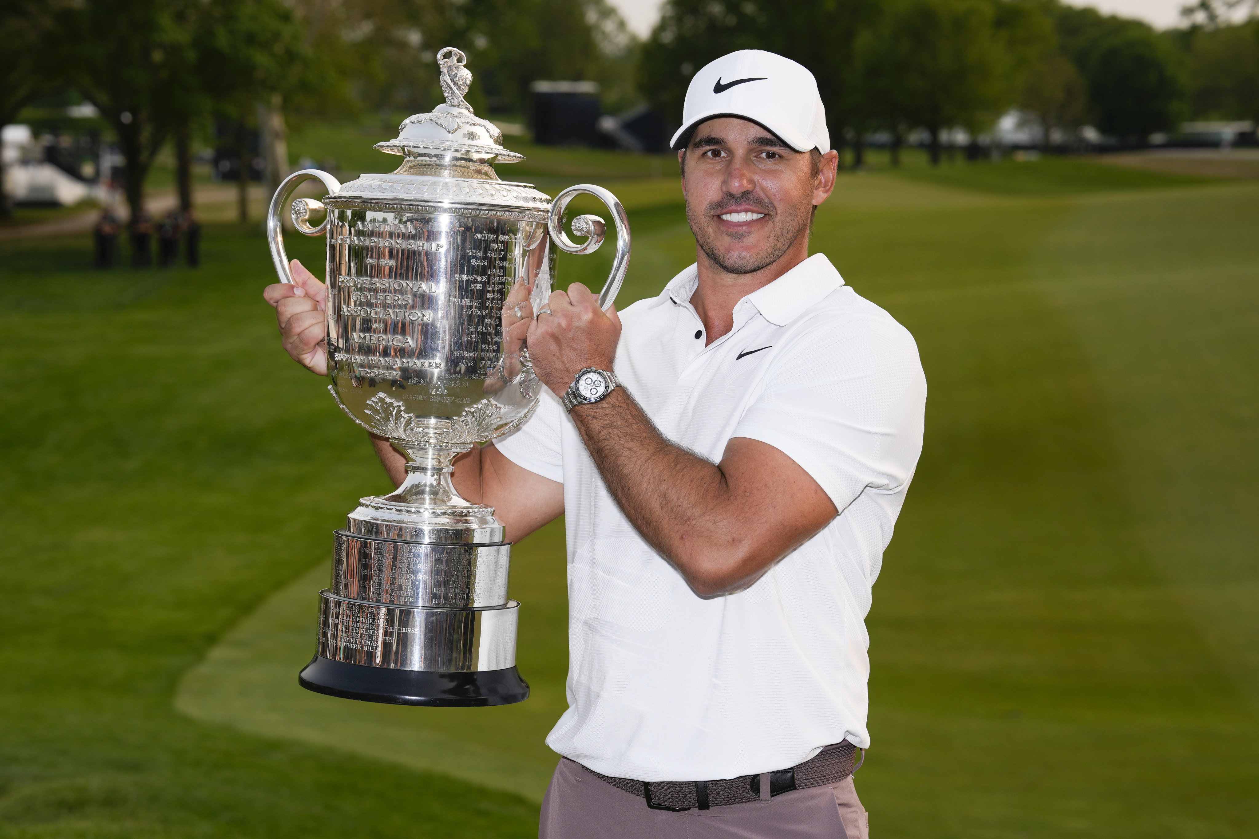 Adventurous moments captured celebrating brooks koepka trophy triumphs