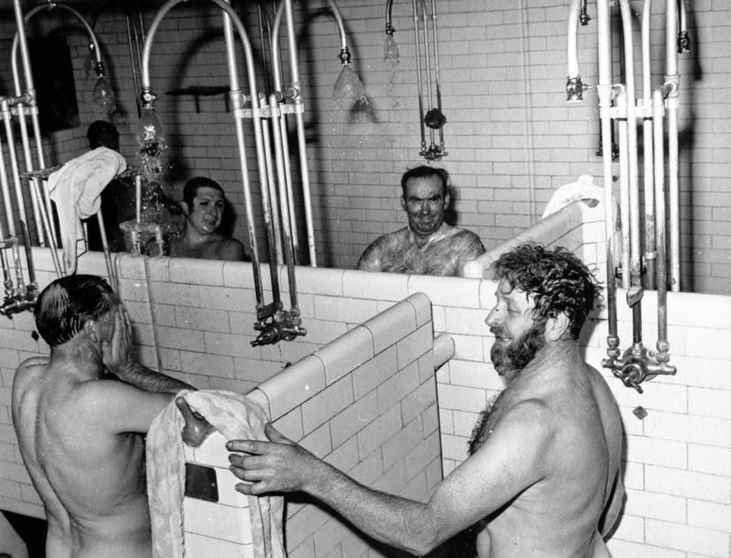 Unstoppable determination of coal miners showering after hard work