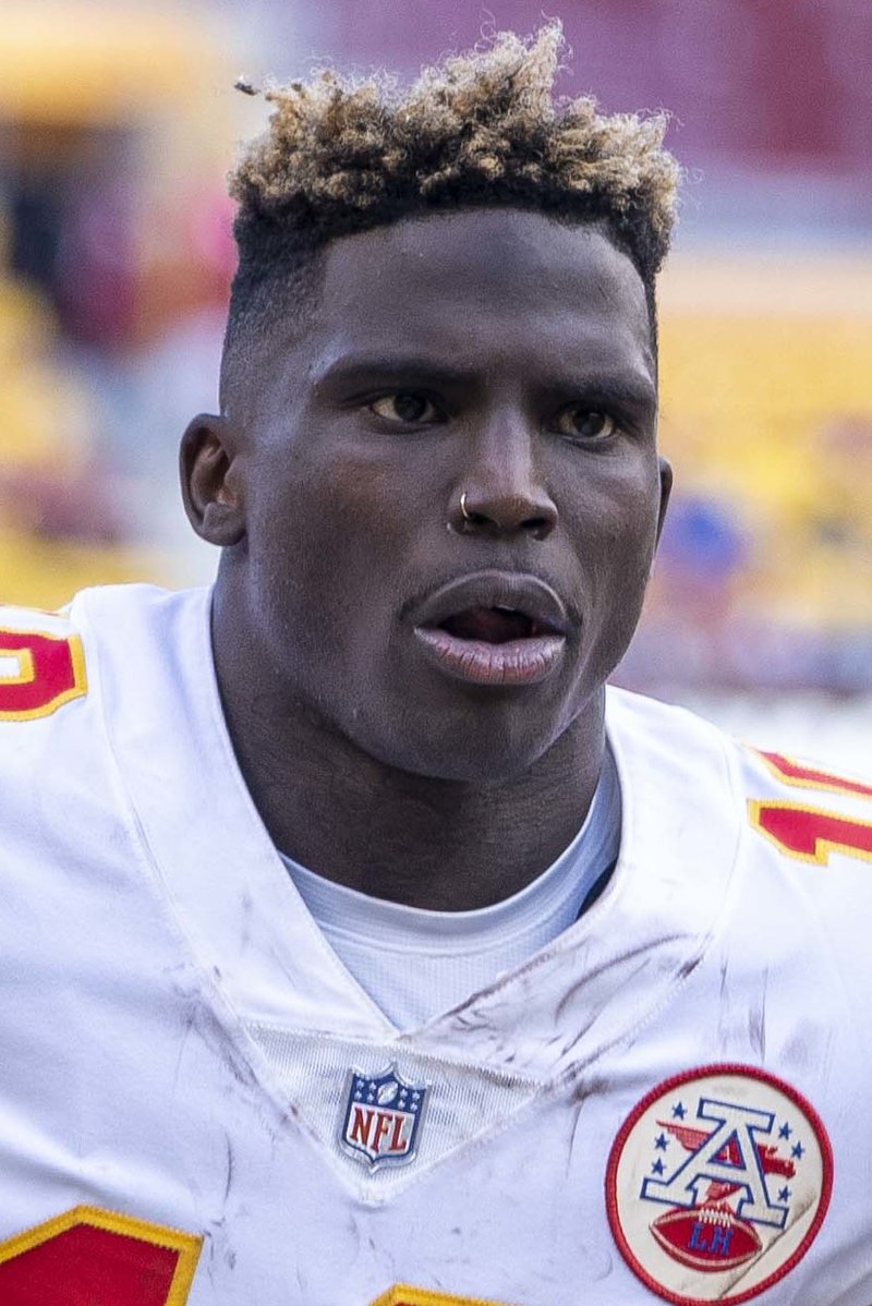 A picture of tyreek hill passionately showcasing his electrifying speed