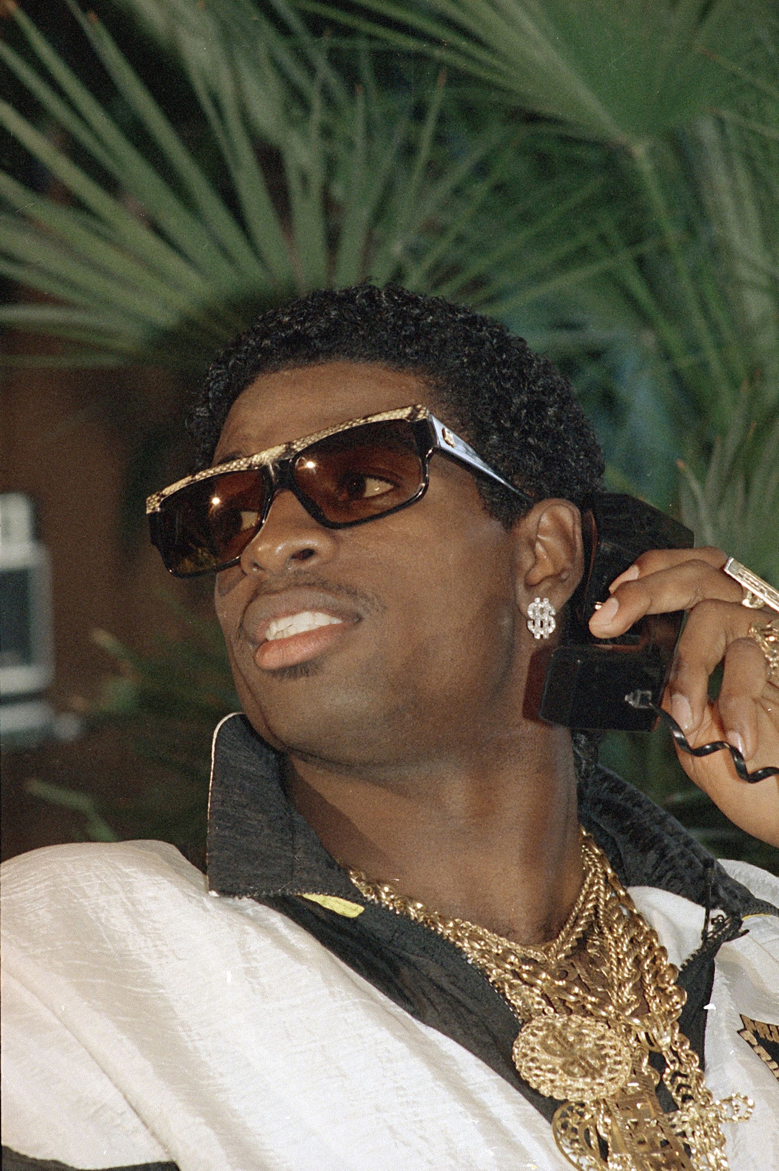 Deion sanders iconic photos showcasing the ultimate sports moments
