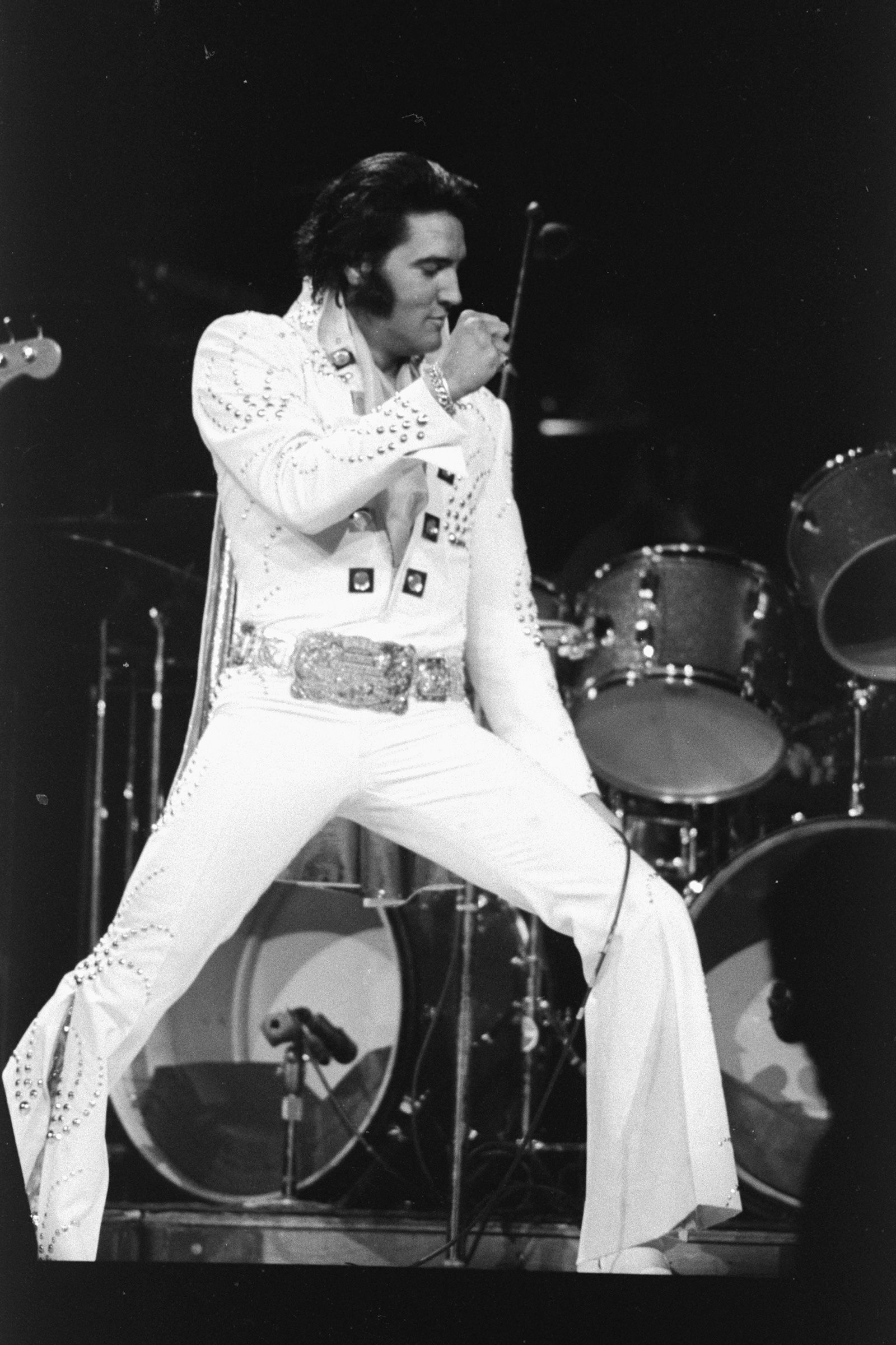 Elvis in white jumpsuit and relentless energy captivating fans everywhere