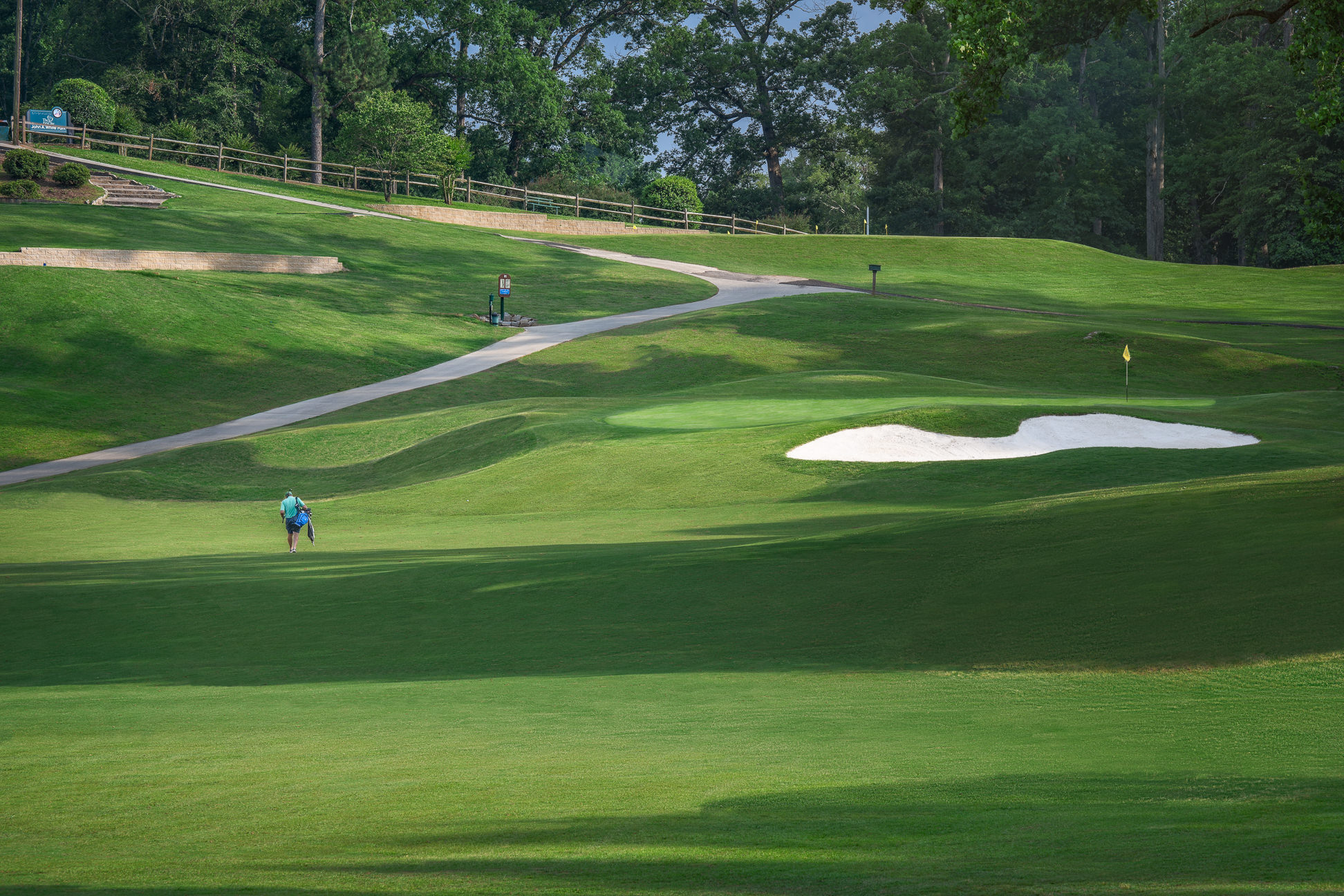 John a white golf course photos showcasing competitive spirit and talent