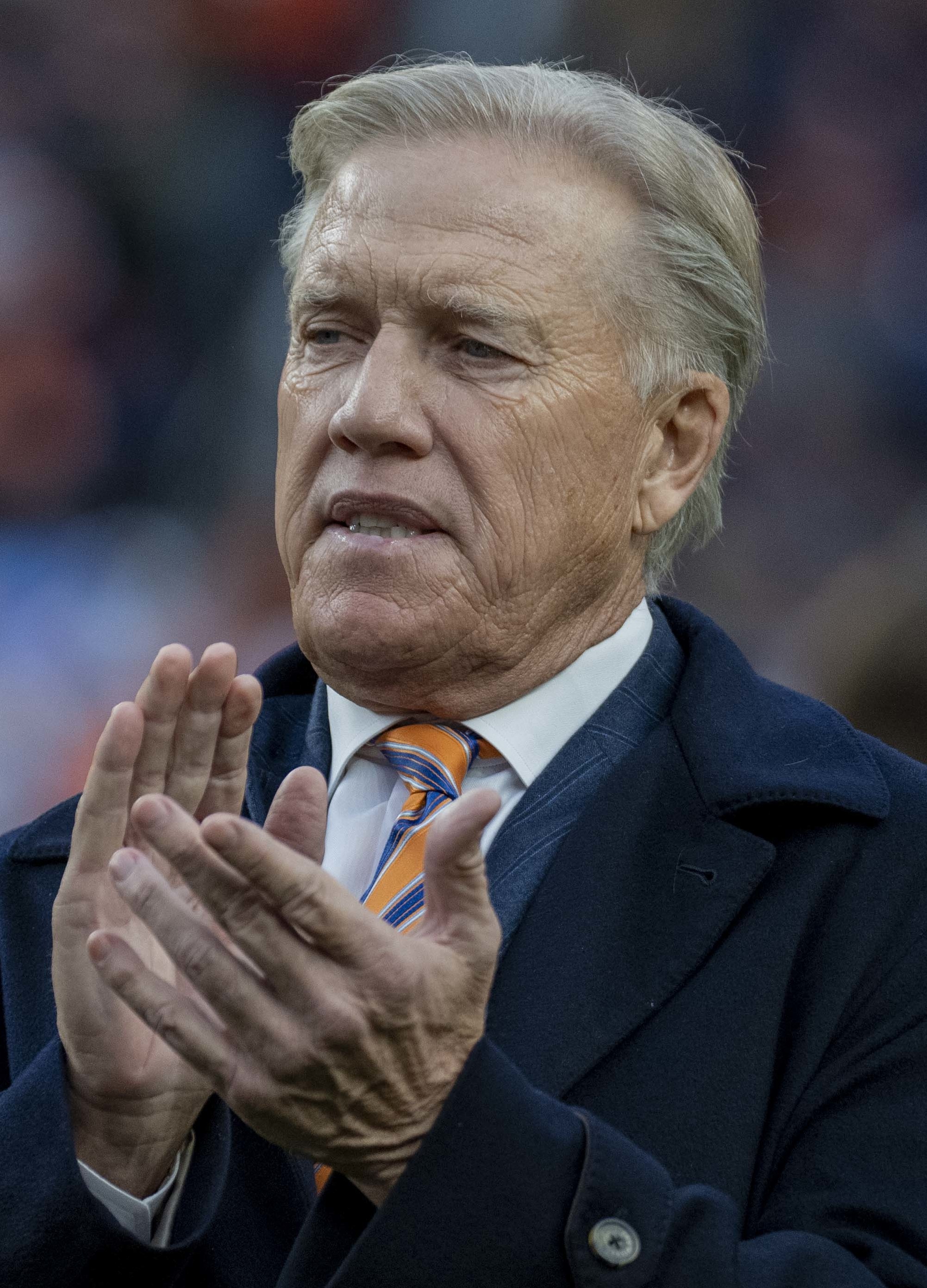 Electrifying john elway images that capture his legendary greatness