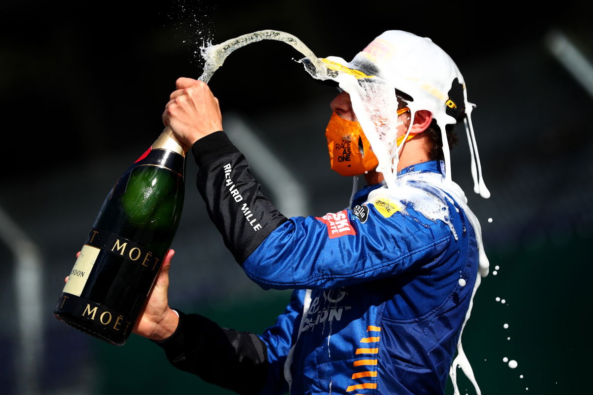 Exciting moments of lando norris celebrating with champagne joyously