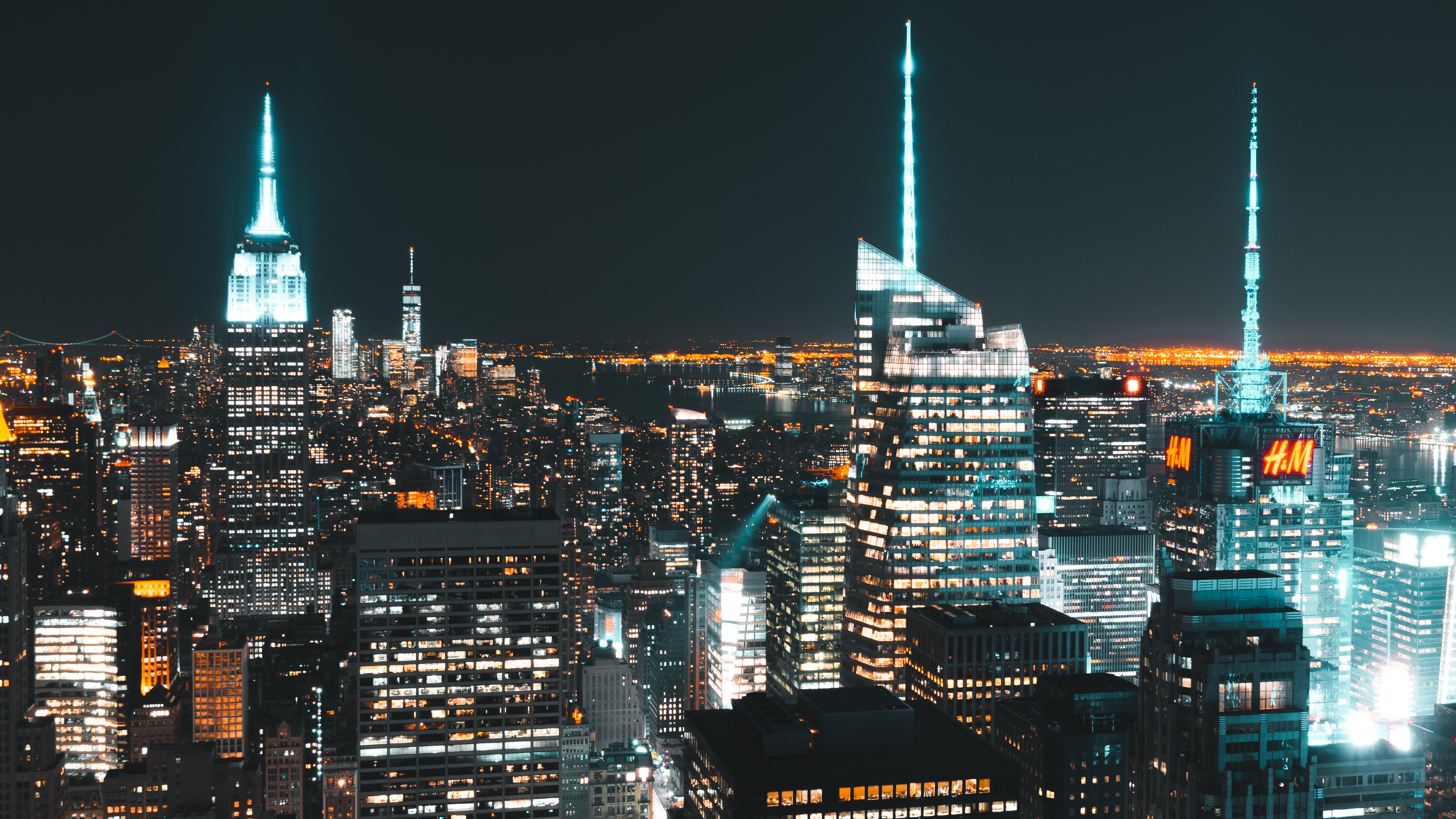 Robust beauty of the manhattan skyline night lights up the sky