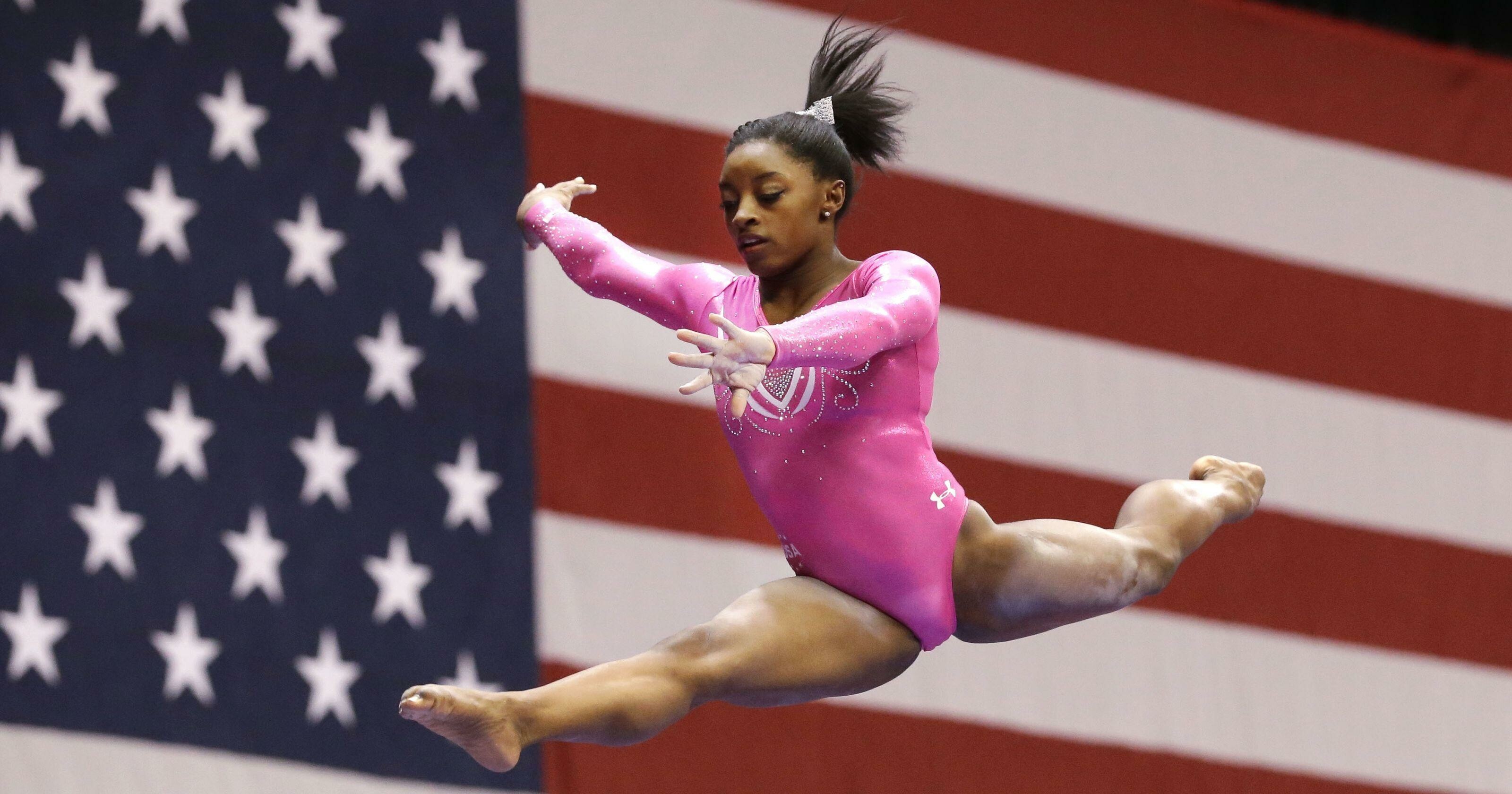 Disciplined simone biles wallpaper to inspire your passion for sports