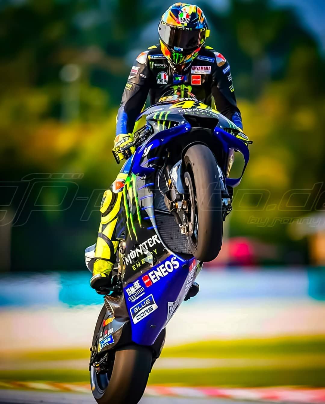 Valentino rossi wheelie relentless style that captivates fans worldwide