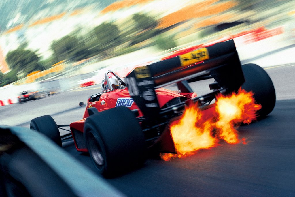 Iconic racing photos capturing triumphant moments in motorsport history