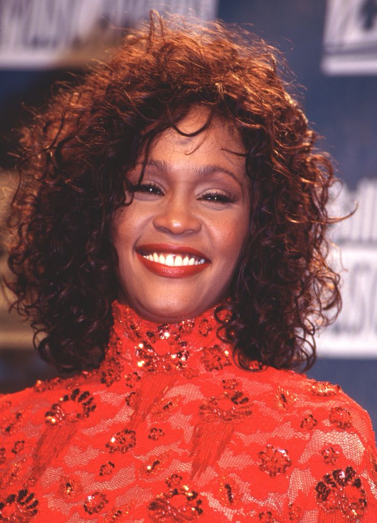 Whitney houston smiling captures the dynamic essence of joy